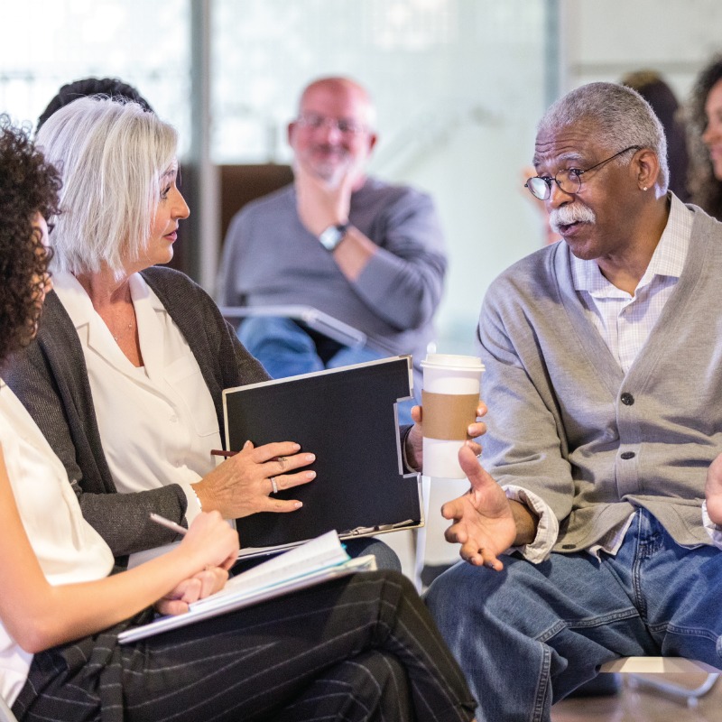 A family caregivers support group talking to each other