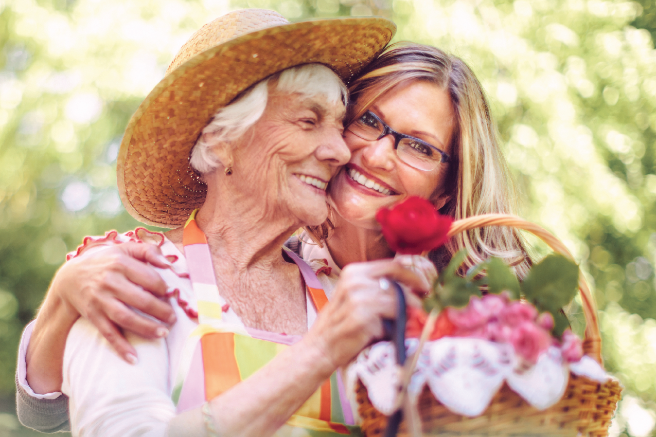 Senior woman picking flowers