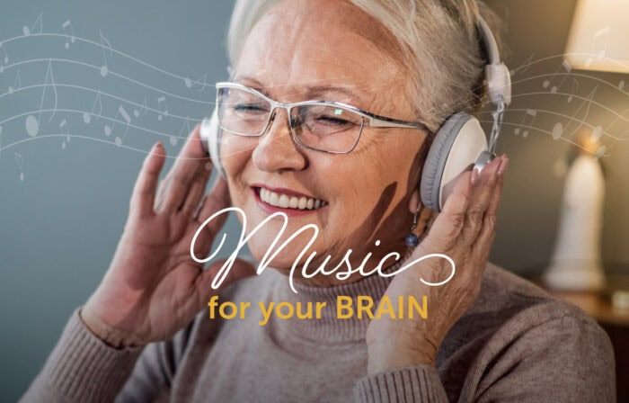 Smiling senior woman listening to music on her headphones