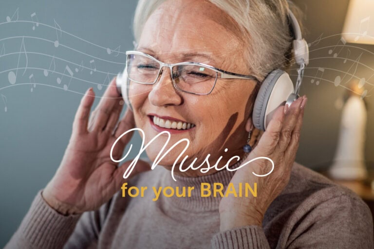 Smiling senior woman listening to music on her headphones